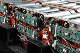 photo of electronics atop a bank of batteries