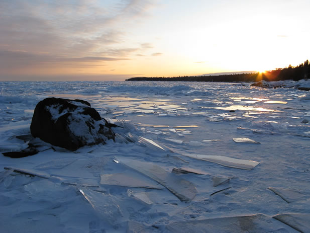 photo of a frozen landscape, plates of ice like shattered glass