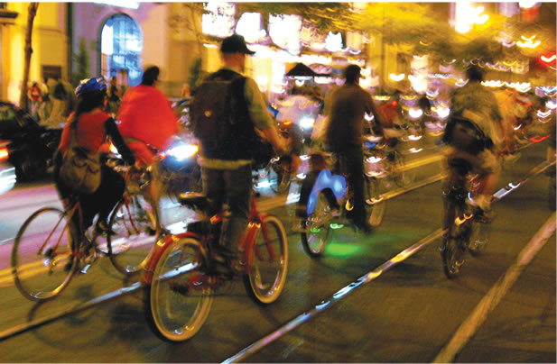 photo of cyclists at night