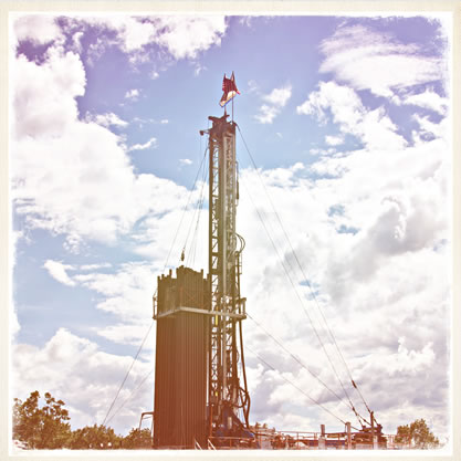 faded image of a fracking tower