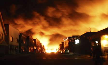 photo of a smalltown mainstreet engulfed in flames