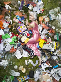 small photo of a woman in evening-wear on a trash-strewn lawn