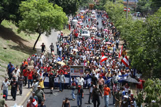 photo of a city street filled with demonstrators all the way to the horizon