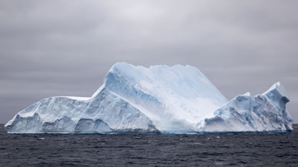 photo of an iceberg on the sea