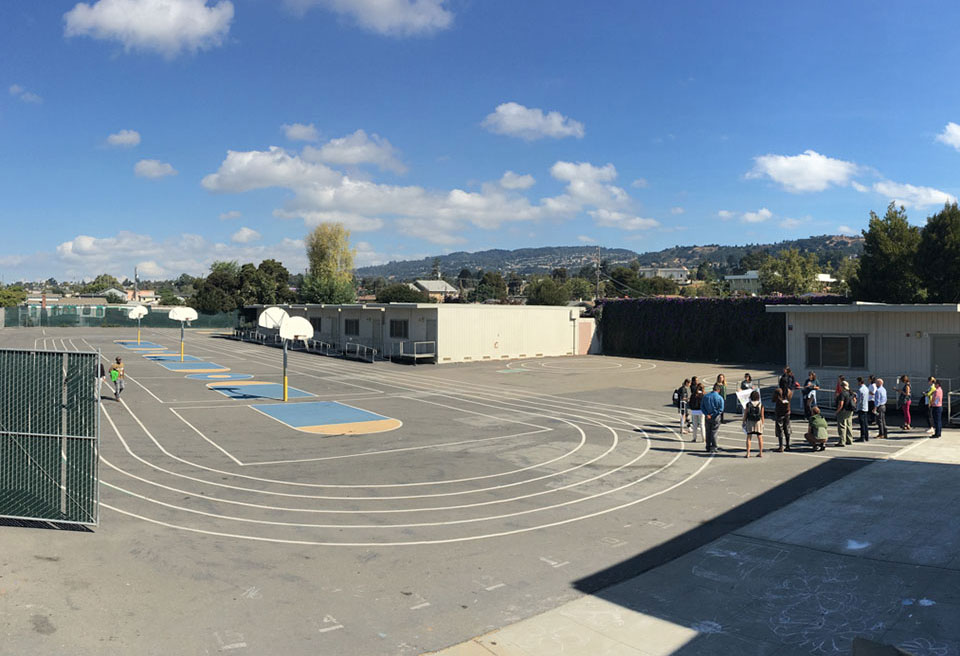 photo of a paved, prison-like schoolyard