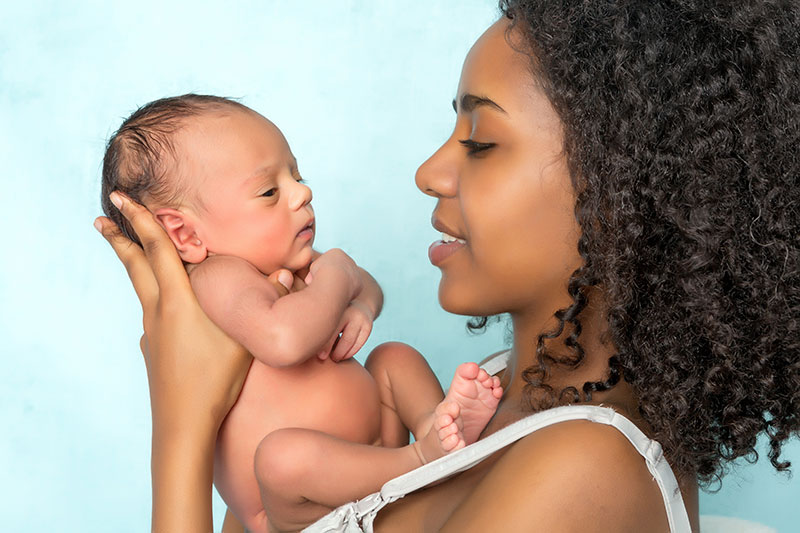 photoof a woman holding a baby